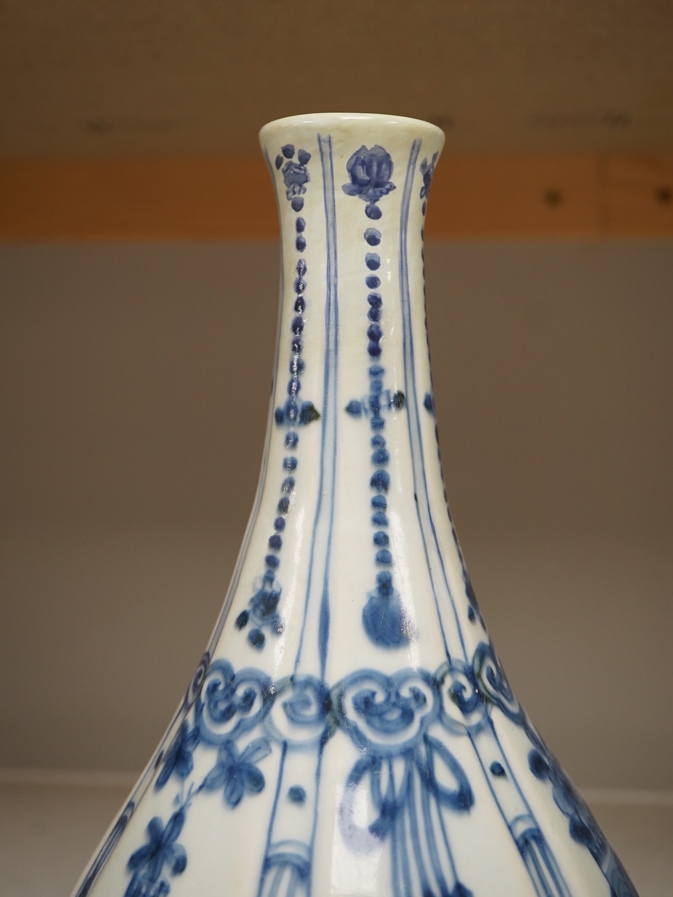 An early 17th century Chinese kraak blue and white bottle vase, 28.5cm. Condition - restored